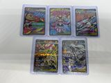 four different pokemon trading cards in plastic cases on a white surface