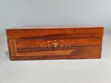 a wooden box with a decorative design on it