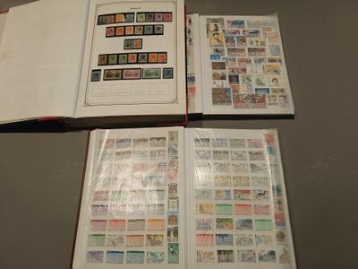two open books with stamps on them sitting on a table