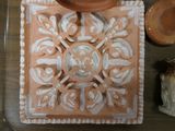 a glass tray with a decorative design on it