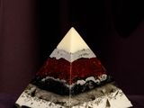 a picture of a pyramid shaped object on a purple surface