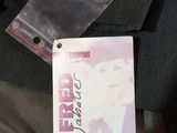 a picture of a person ' s jacket with a tag attached to it