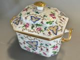 an image of a porcelain box with flowers on it