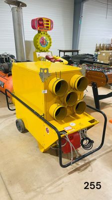 a yellow machine that is sitting in a warehouse