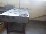 a workbench in a garage with tools on it