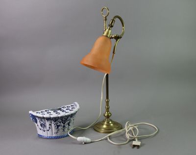 a lamp that is sitting next to a bowl