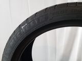 a close up of a tire on a white surface