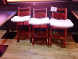 three chairs that are sitting in front of a window