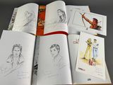 a lot of drawings on the pages of a book