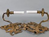 pair of antique brass candlesticks with white candlestick holders