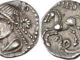 a close up of a coin with a horse on it