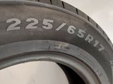 a close up of a tire on a white surface