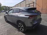 the rear end of a silver suv parked in a parking lot