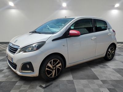 the white car is parked in a room with a checkered floor
