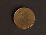 a close up of a coin on a black surface