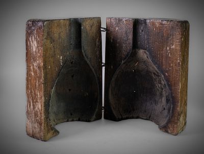 a pair of wooden spoons that are on a table