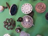 a lot of buttons on a green surface