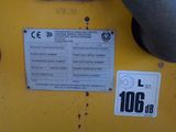 a close up of a sign on a yellow machine