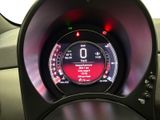 a dashboard of a car with a digital clock on it