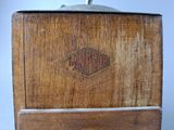 a wooden box that has a logo on it