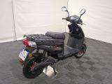 a scooter that is parked in a garage