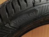 a close up of a tire on a wooden surface