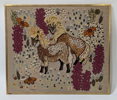 embroidered picture of a horse and her foal in a field of flowers