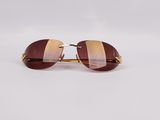 a pair of sunglasses on a white surface