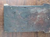 a piece of wood that has been scratched off on the floor