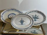 three plates that are sitting on a gold tray