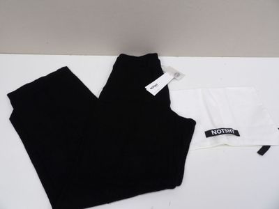 two pairs of black and white leggings on a white table