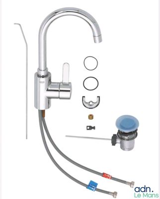 a close up of a sink faucet with a hose and a sink faucet