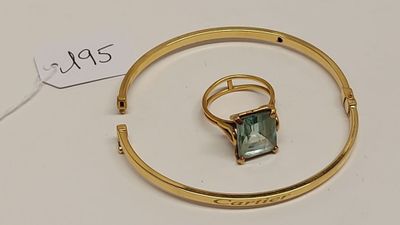 une image représentant une bague en or sertie d'une pierre verte