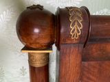 a close up of a wooden pole with a ball on it