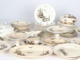 a lot of plates and bowls that are on a table