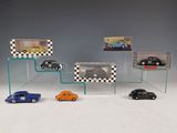 several toy cars are on display in a glass display case