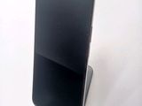a cell phone that is sitting on top of a stand