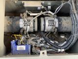 a dirty air conditioner that is in the back of a truck