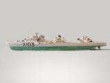 a model of a boat on a gray surface