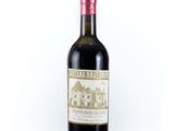 a bottle of wine that is sitting on a table