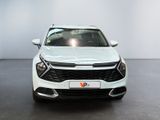 the front view of a white suv parked in a showroom