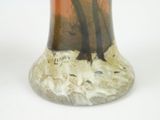 a vase that has a picture of a tree in it