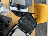 several pieces of luggage sitting on top of a table next to a yellow chair