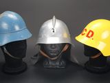 three helmets that are sitting next to each other on a mannequin head