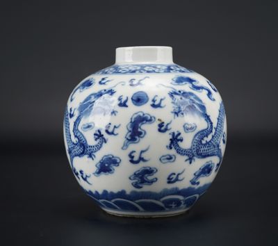 blue and white porcelain vase with a dragon design on the outside