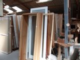 several pieces of wood are stacked up in a warehouse
