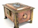 a small metal box with a clock on top of it