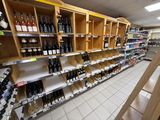 many bottles of wine on the shelves in the store