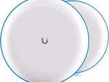 a close up of three white circular devices on a white surface