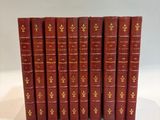 a set of five red books sitting on top of each other